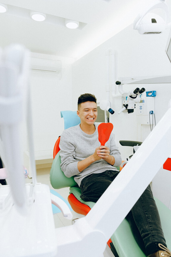 Male patient in dentist’s chair